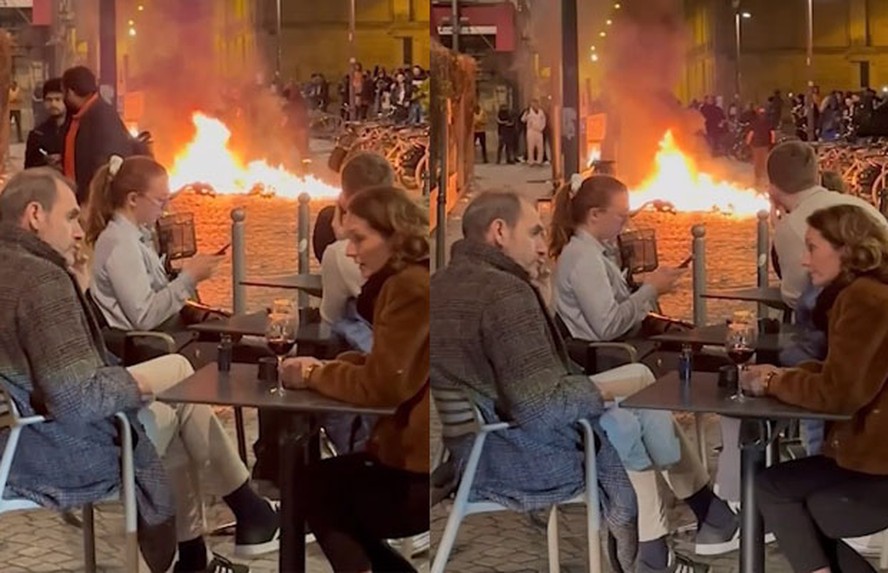Casal viraliza ao ignorar caos na rua durante protestos na França