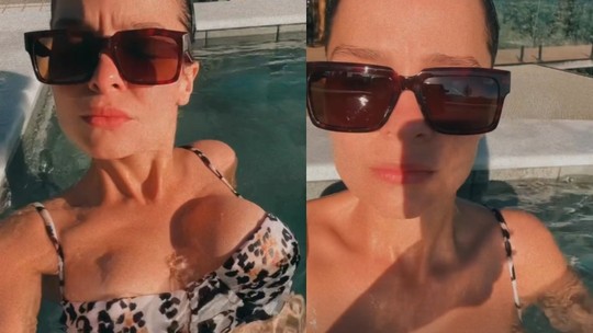 Maiara curte sol na piscina pela manhã em biquíni de animal print
